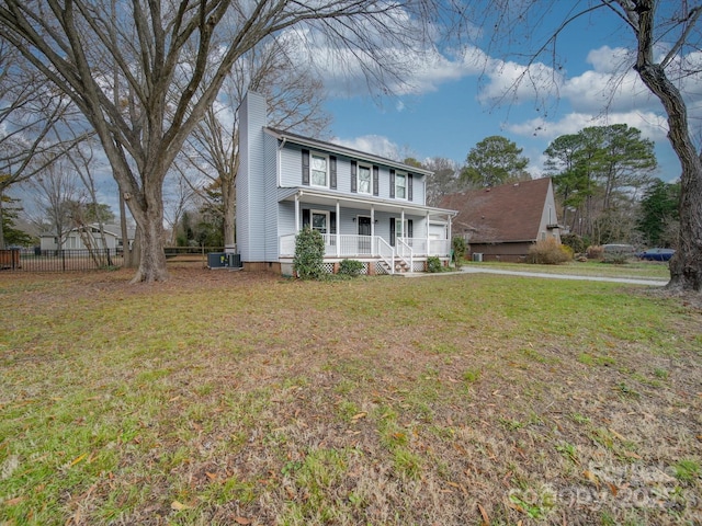 view of front of property with a front lawn, a porch, and central air condition unit