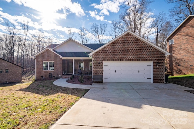 view of front of property featuring a garage and a front lawn