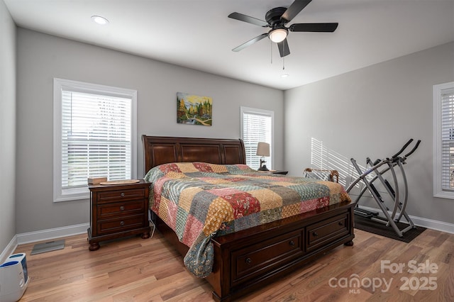 bedroom featuring light wood-type flooring and ceiling fan