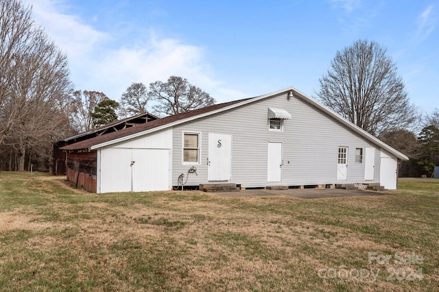 rear view of house with a yard