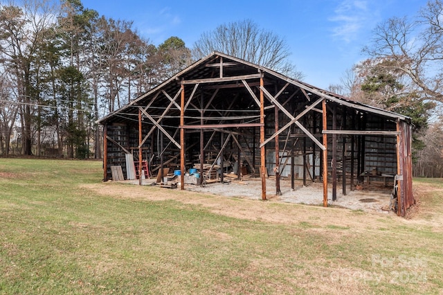 view of outbuilding with a lawn