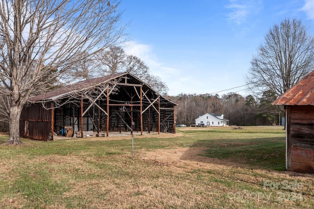 view of outdoor structure with a lawn