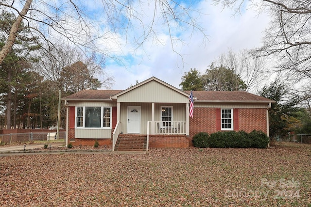 ranch-style home with covered porch