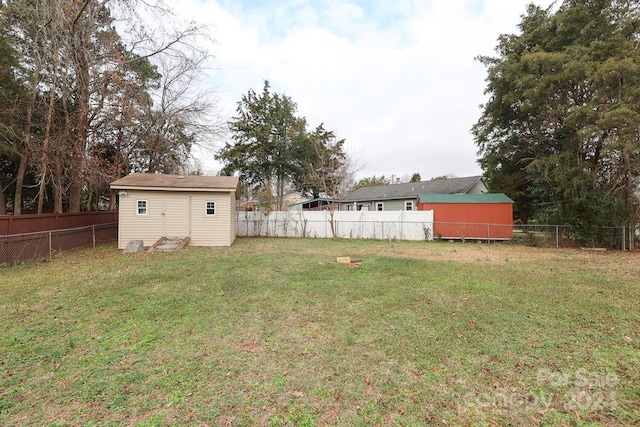 view of yard with a storage unit