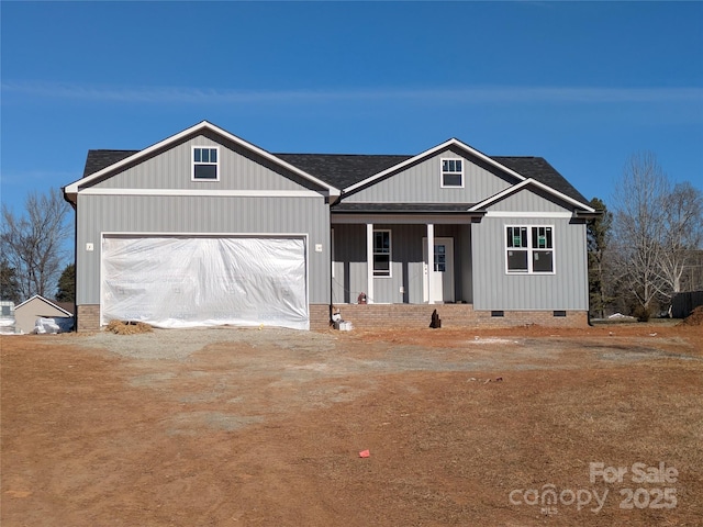 view of front of house with a garage and covered porch