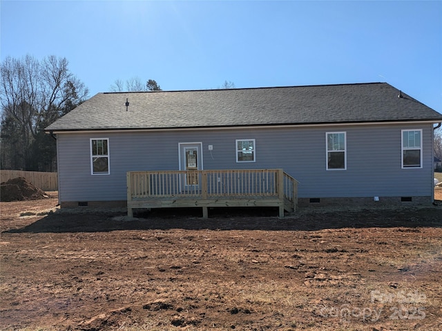 rear view of house with a wooden deck