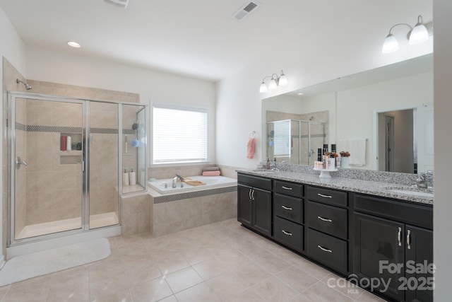 bathroom with tile patterned floors, separate shower and tub, and vanity