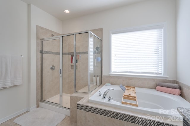 bathroom with shower with separate bathtub