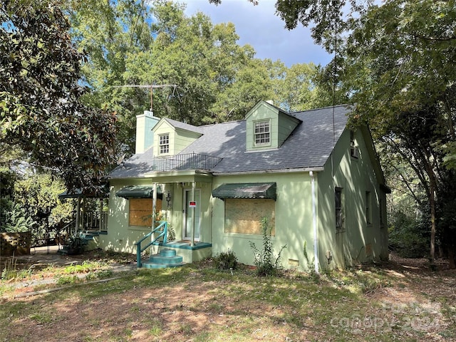 view of new england style home