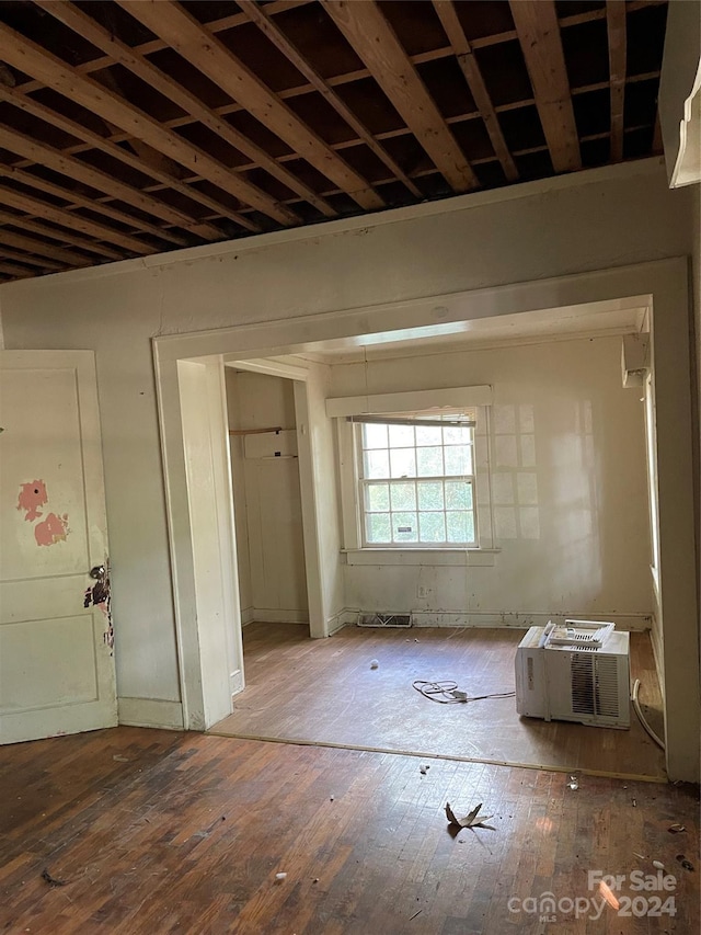 miscellaneous room with hardwood / wood-style floors and a wall mounted AC