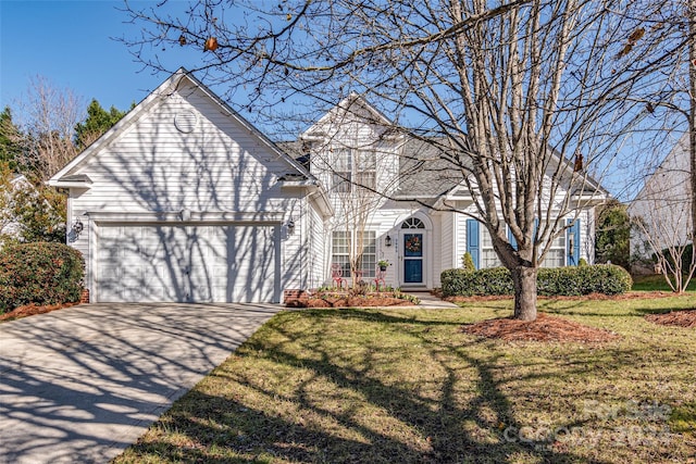 front of property featuring a garage and a front yard