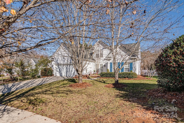 view of front facade with a garage and a front yard