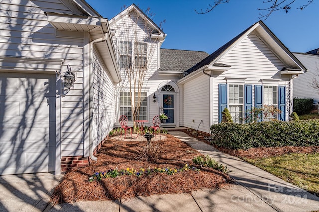 view of front of property with a garage