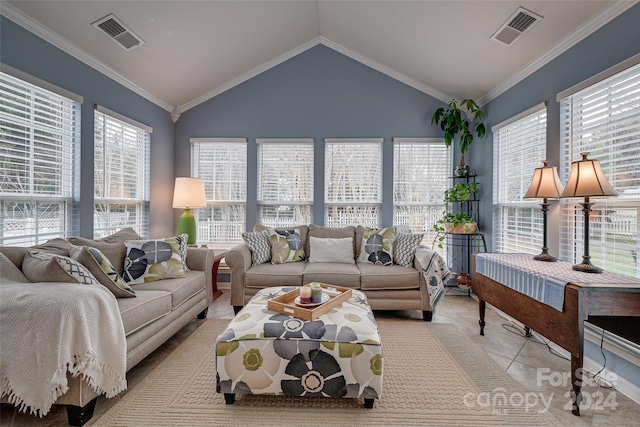 tiled living room with a healthy amount of sunlight, lofted ceiling, and ornamental molding