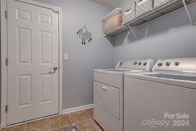 clothes washing area with washing machine and clothes dryer