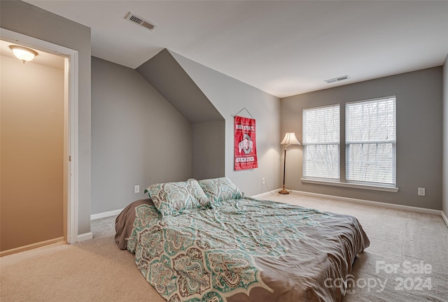 bedroom featuring light colored carpet