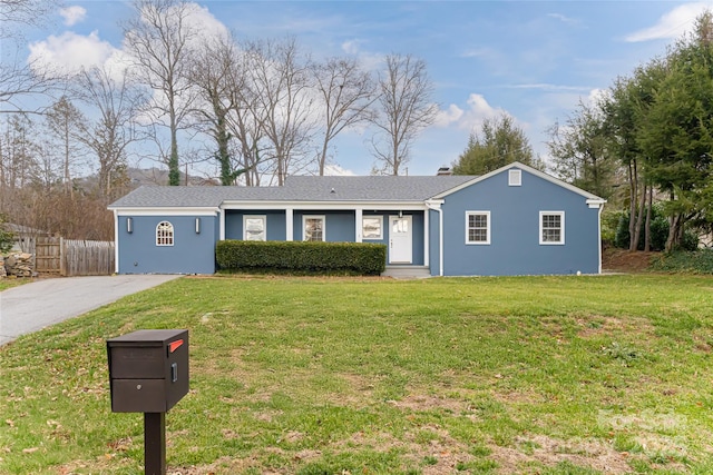 single story home with a front yard