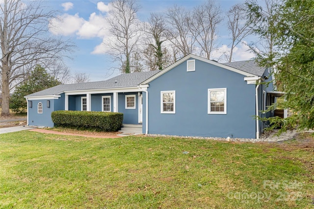 ranch-style home with a front lawn