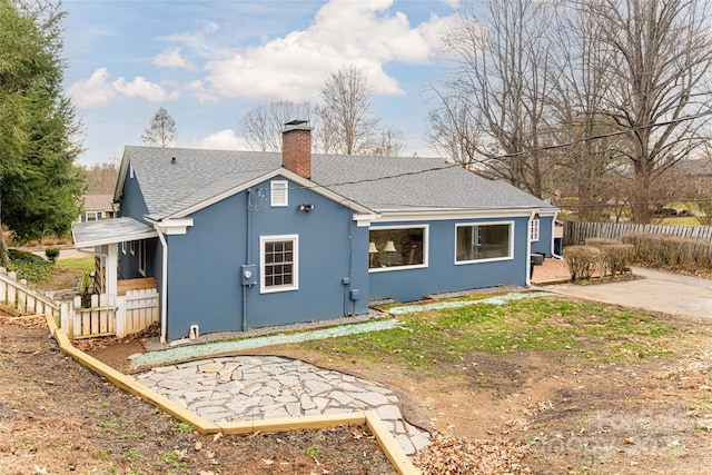 rear view of house with a patio