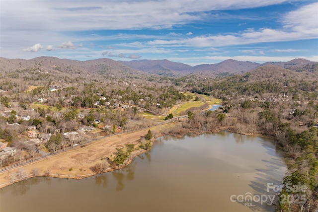 bird's eye view with a water and mountain view