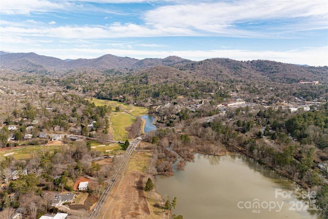 aerial view featuring a water and mountain view