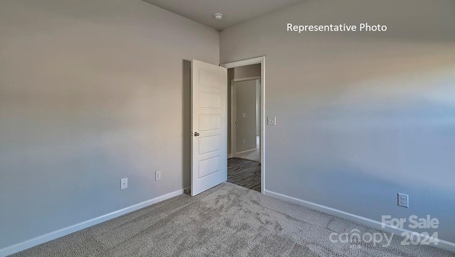 unfurnished room with carpet flooring