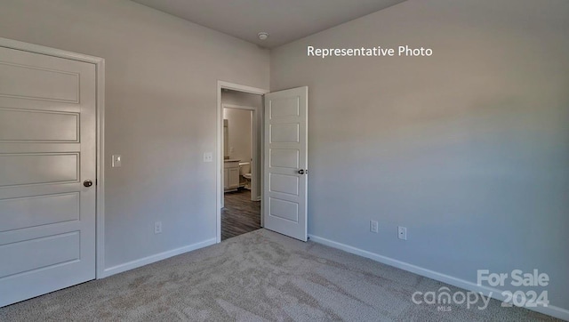 unfurnished bedroom featuring carpet flooring