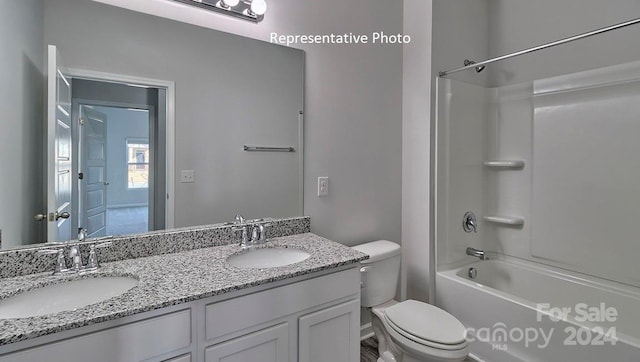 full bathroom featuring shower / tub combination, vanity, and toilet