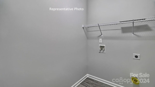 washroom featuring hookup for a washing machine, hardwood / wood-style flooring, and electric dryer hookup