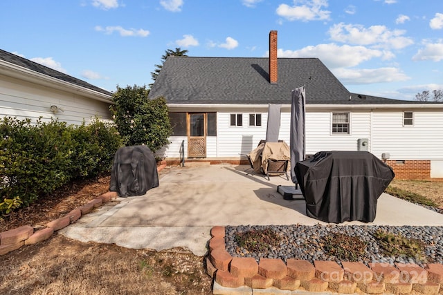 back of house with a patio