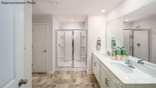 bathroom with vanity and walk in shower