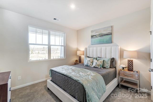 bedroom with visible vents, carpet, and baseboards