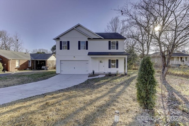 view of front property with a front yard and a garage