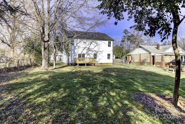 view of yard with a wooden deck