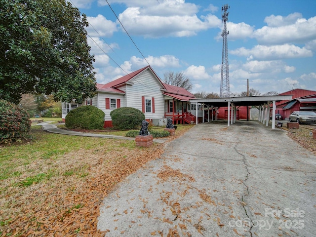 bungalow-style house featuring a carport