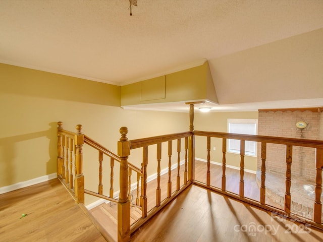 bonus room with hardwood / wood-style flooring and vaulted ceiling