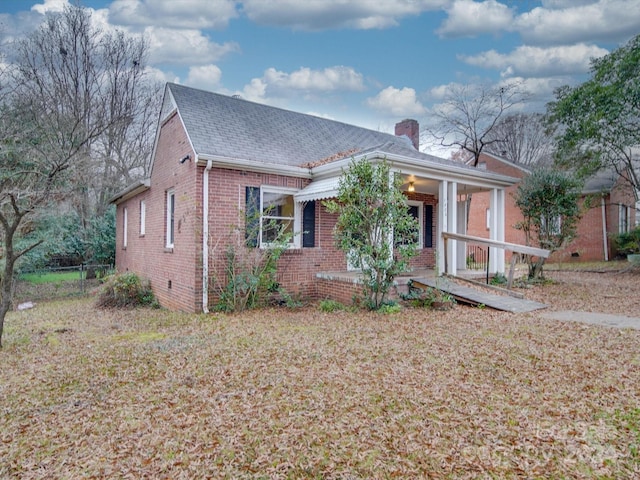 view of front of home with a front yard