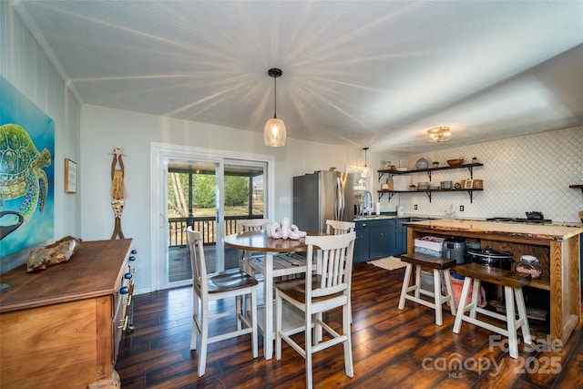 dining room with dark hardwood / wood-style flooring