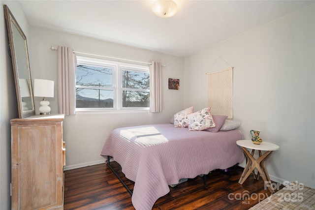 bedroom featuring dark hardwood / wood-style floors