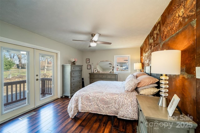 bedroom featuring access to exterior, ceiling fan, french doors, and dark wood-type flooring