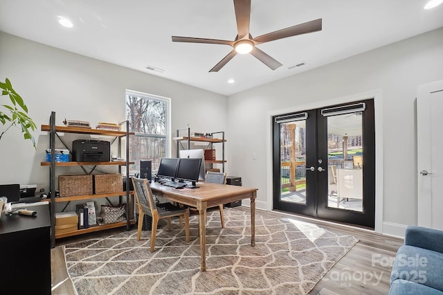 office space with hardwood / wood-style floors, ceiling fan, and french doors