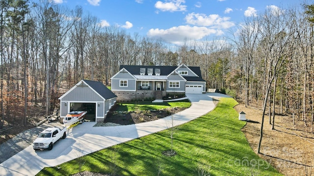 view of front of home with a garage and a front lawn