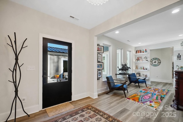 foyer with light hardwood / wood-style flooring