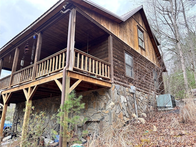 view of side of home featuring a deck