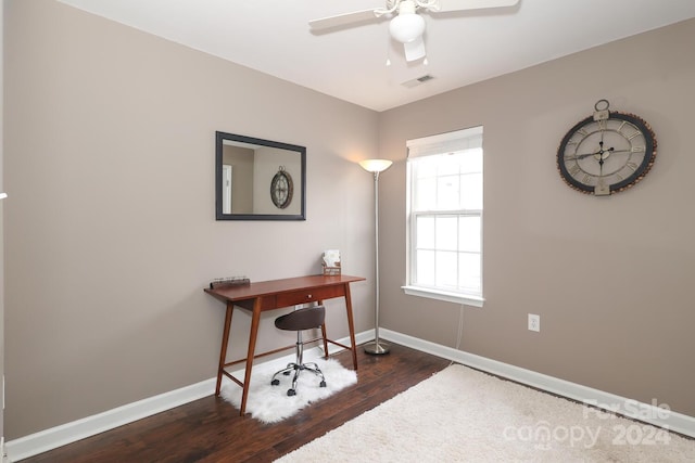 office space with ceiling fan and dark wood-type flooring