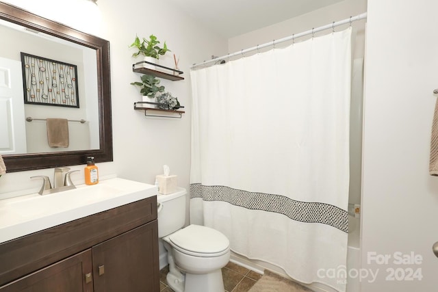 bathroom with tile patterned floors, vanity, and toilet