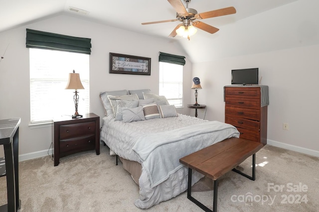 carpeted bedroom featuring ceiling fan and vaulted ceiling