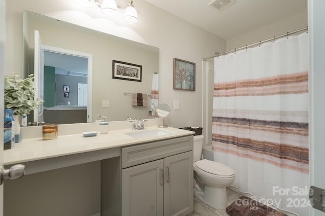 full bathroom with vanity, toilet, and shower / bath combo