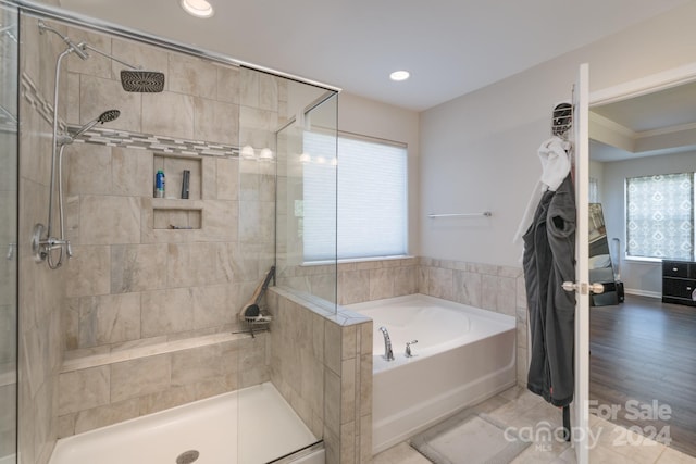 bathroom with tile patterned floors and plus walk in shower