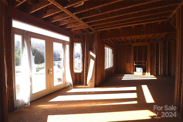 miscellaneous room featuring french doors and a healthy amount of sunlight